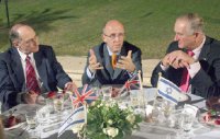 UK Trade and Investment Minister Lord Mervyn Davies speaking with Amnon Dotan (right) and Gad Propper (left) at a dinner with Israeli business leaders at the official residence of British Ambassador to Israel, Tom Phillips, in Ramat Gan on 19 May 2009